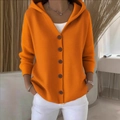Detailed knit texture of orange hooded cardigan featuring dark buttons and a casual fit - S / Orange
