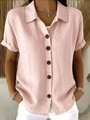 Close-up of pink short sleeve shirt with wooden buttons and textured fabric finish - S / Pink