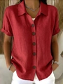 Detail of red short sleeve shirt showing linen texture and dark brown buttons - S / Red