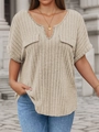 Close-up of beige ribbed fabric detail on V-neck short sleeve top with faux pockets - 1XL / Apricot