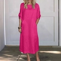 Detail of hot pink linen dress featuring roll-up sleeves and functional side pockets - Rose Red