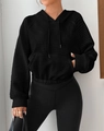 Detail of black waffle knit hoodie showing quilted diamond texture and kangaroo pocket - S / Black