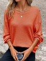 Detailed close-up of orange waffle knit texture on loose round neck long sleeve sweatshirt - Orange