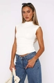 Detail view of the elegant ruched texture on a white sleeveless turtleneck top - S / Tops / White