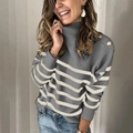 Close-up of mock neck striped sweater with gold button details on the shoulder - S / Grey Stripe