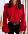 Detail view of red long sleeve blouse featuring an elegant bow tie neck and chiffon fabric - S / Red