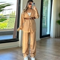 Detail of leopard print satin two-piece set with a long sleeve shirt and wide-leg pants - Coffee