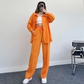 Detailed texture of orange long-sleeve shirt and pleated trousers set in cotton-linen fabric - Orange