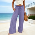 Detail of high waisted wide leg cotton linen trousers in light purple with ruffle waistband - S / Purple