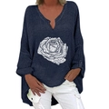 Detail of V-neck cotton linen blouse featuring white rose print and navy blue textured fabric - S / Tops / Navy Rose Print (1266X)