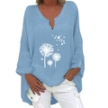 Detail view of light blue linen blouse featuring V-neck and white dandelion print - S / Tops / Sky Blue Dandelion Print (1267X)
