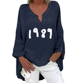 Detail of navy blue V-neck linen shirt with white 1989 print and irregular hem - S / Tops / Navy 1989 Print (1269X)