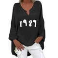 Detail view of black V-neck long sleeve top featuring white 1989 printed graphic design - S / Tops / Black 1989 Print (1269X)