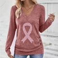 Detail of pink ribbon sequin print and button accents on the V-neck long sleeve top - S / Watermelon red