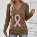 Detail view of mocha brown V-neck top featuring pink sequin ribbon and side buttons - S / Brown