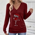 Detail of elegant V-neck wine red top with Christmas wine glass print and button accents - S / Burgundy