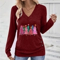 Detail view of the elegant V-neckline and decorative buttons on the wine red Christmas top - S / Burgundy