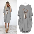 Detail view of grey loose-fit dress featuring colorful deer print and side pockets - S / Gray