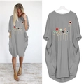 Detail of loose fit dark grey dress with abstract floral print and large side pockets - S / Gray