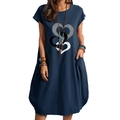 Detail of navy blue cotton linen dress showing artistic heart prints and side pockets - S / Navy Blue