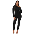 Detail of black ribbed knit two-piece set featuring off-shoulder top and slim trousers - Black
