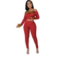 Detail of red off-shoulder top and pants set featuring stylish faux fur trim accents - S / Red