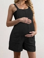 Dettaglio della tutina premaman nera con trama a maglia e tasche laterali quadrate - Taglia S / Tute intere / Nero