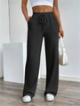 Detailweergave van de zwarte high-waist broek met wijde pijpen en wafeltextuur stof - S / Zwart