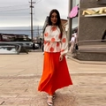 Chique tweedelige set voor dames met bloemenprint top en oranje geplooide maxi-rok dames - S / Oranje Geplooide Set
