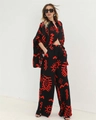 Detail of loose fit shirt and wide leg pants with red tribal print on black fabric - Red (A292)