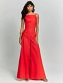 Close-up of red high-waisted wide-leg jumpsuit with symmetrical pocket details - S / Red