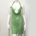 Close-up of green sequin halter dress featuring luxury metallic mesh and rhinestones - Green