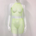 Detailansicht des neongrünen Strass-Netz-Sets bestehend aus Crop-Top und Minirock - Einheitsgröße / Oberteil Und Unterteil / Fluoreszierendes Grün