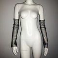 Detailed close-up of long black mesh sleeves with shimmering colorful rhinestones - Black