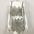 Close-up detail of silver rhinestone mesh crop top and mini skirt for party wear - One Size / Silver Jewelry Set