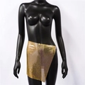 Macro detail of golden metal chainmail mini skirt featuring a reflective mesh texture - Asymmetric Hem Style 1