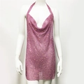 Macro shot of pink metallic mesh dress fabric with shimmering rhinestone details - Pink
