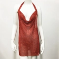 Detailed close-up of red rhinestone mesh fabric on a sexy halter neck party dress - Red