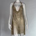 Detail of gold rhinestone halter dress featuring deep V-neck and fringe hemline - S / Gold