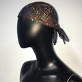 Detail of black mesh headwrap featuring shimmering rhinestones and a tie-back design - Black Iridescent Rhinestone