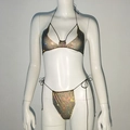 Close-up of sparkling rhinestone mesh bikini set with adjustable side-tie details - Black AB Rhinestone
