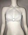 Detail of rhinestone mesh halter top featuring a metal ring connector and crossed straps - White