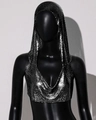 Macro detail of silver metal mesh texture on a hooded crop top with shimmering sequins - Black