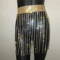 Macro detail of sparkling gold rhinestone tassel chain and metal mesh waistband - Wide Dense Chain Style / Gold