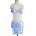 Close-up of iridescent diamond sequin top and mini skirt set with silver metal chain links - Light Blue