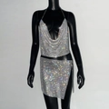Detail of silver metallic mesh two-piece set featuring halter crop top and mini skirt - S / Silver