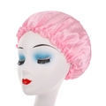 Pink satin sleep cap with elastic lace edge on mannequin head for hair care - Pink