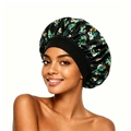 Détail du bonnet de nuit floral en satin montrant la large bande élastique et le tissu lisse - Noir