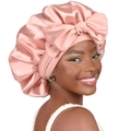 Pink satin extra large bonnet hair wrap with bow for women shown on model - Champagne