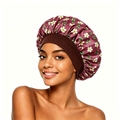 Detail of floral burgundy satin hair bonnet with wide elastic brown headband on model - Burgundy